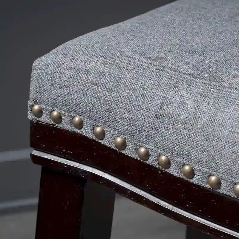 Tabouret de comptoir contemporain rembourré en forme de selle avec garniture cloutée
