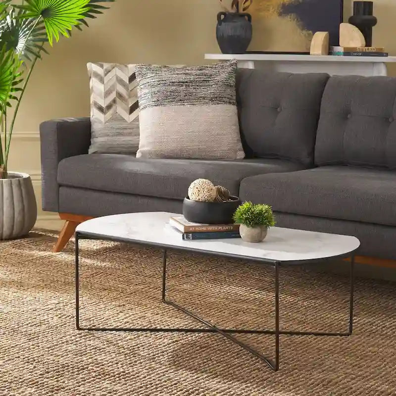 Table basse ovale minimaliste avec piètement croisé en métal noir
